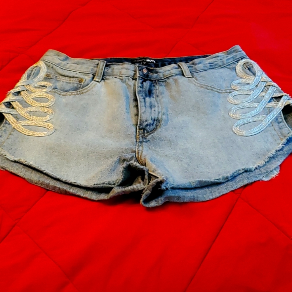 Fashion Nova light blue shorts with silver side designs,  high thigh.